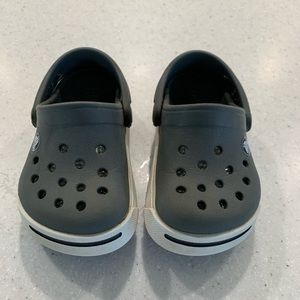 Grey CROCS.
